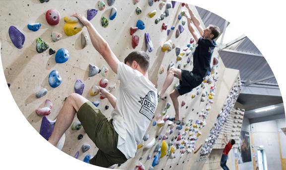 2 boys on an indoor climbing wall
